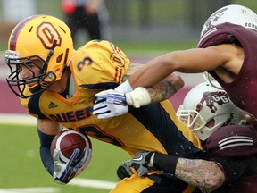 The Ottawa Gee-Gees took on the Queens Gaels during CIS football action in Ottawa On, Saturday Sept 21, 2013. Justin Chapdelaine ran the ball up the middle against the Gee-Gees Saturday. The Gaels defeated the Gee-Gees 36-21. 
Tony Caldwell/Ottawa Sun/QMI Agency