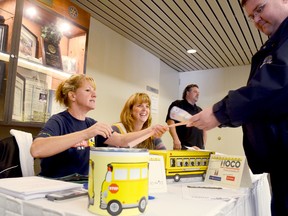 Shelby MacPherson of County Bus Service, left, and Sherry Barker of Al Parkhurst Transportation welcome guest to the Tri-Board School Bus Operators Association driver appreciation breakfast Sunday morning at the Travelodge Hotel in Belleville. 
EMILY MOUNTNEY The Intelligencer