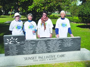 (L-R): Sunset Palliative Care volunteers Barbara Jones, Zennia Semchyshyn, volunteer co-ordinator Sue Gray and Barb Bolack pose by a plaque near the Memory Garden Sept. 22. (Kevin Hirschfield/THE GRAPHIC/QMI AGENCY).