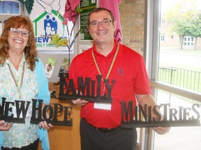 Linda Jacklin and Pastor Phil Cole of Woodstock-based New Hope Family Ministries stand in front of some of the information that was on display when the faith-based organization dedicated to providing resources to address abuse in church congreagtions hosted its first conference at Huron Park Baptist Church on Saturday, Sept. 21, 2013. JOHN TAPLEY/INGERSOLL TIMES/QMI AGENCY