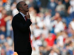 Sunderland's manager Paolo Di Canio gestures to fans after their English Premier League soccer match against West Bromwich Albion at The Hawthorns in West Bromwich, central England, September 21, 2013. REUTERS/Darren Staples
