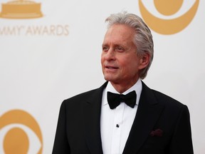 Michael Douglas from HBO's movie "Behind the Candelabra" arrives at the 65th Primetime Emmy Awards in Los Angeles, Sept. 22, 2013. (REUTERS/Mario Anzuoni)