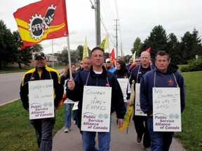 Sarnia-Lambton members of the Customs and Immigration Union marched Monday morning on the Sarnia office of Sarnia-Lambton MP Pat Davidson. The customs officers have been working without a contract for more than two years and want the federal government to return to the bargaining table. SUBMITTED PHOTO