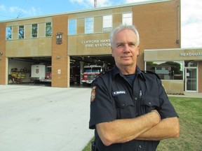 Kevin McHarg stands outside the fire hall on East Street where he officially retired Monday after 33 years as a Sarnia firefighter. PAUL MORDEN/ THE OBSERVER/ QMI AGENCY