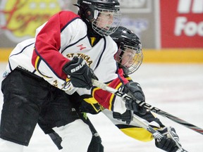 St. Thomas's Gracie Clinton, foreground, battles a Haldimand foe in the Panthers' 4-0 victory Saturday at the Early Bird Showcase. Contributed