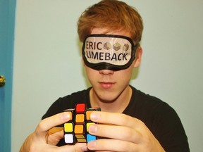 Eric Limeback solves a Rubik's Cube while blindfolded at the Toy Corner in Sarnia. The 20-year-old Toronto native, who holds the Canadian record for the fastest such feat, was in town in 2013 to help celebrate the independent Toy Store's 15th anniversary. HEATHER BROUWER/ SARNIA THIS WEEK/ QMI AGENCY