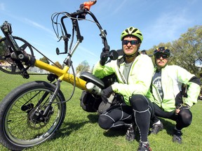 Lloyd McLean (l) and Bob MacDonald pose with their tandem bike in Winnipeg, Man. Monday September 23, 2013. The pair are cycling across Canada to raise money for the CNIB.
BRIAN DONOGH/WINNIPEG SUN/QMI AGENCY