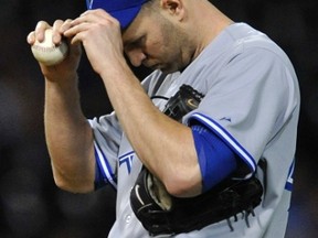 Toronto Blue Jays starter J.A. Happ reacts after walking Chicago White Sox infielder Jeff Keppinger to load the bases at U.S. Cellular FIeld in Chicago, Sept. 23, 2013. (PAUL BEATY/Reuters)