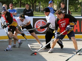 Fish Hookers Jeff Paulley, left, and Jeff Drexler fight for the ball in the final against the Windsor Stars during their London qualifying tournament. A pair of Sarnia teams is headed to Yarmouth, Nova Scotia to compete in Hockey Night in Canada's Play-On! 4-on-4 Hockey Tournament series for the Redwood Cup. (The Observer)