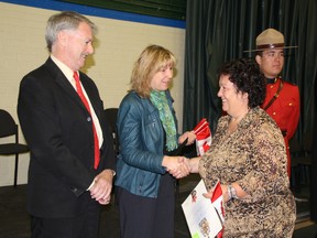 Kettle Point resident Annette Lunham receives congratulations during the Canadian citizenship ceremony held at St. Patrick's Catholic High School Tuesday. The 57-year-old decided to get her Canadian citizenship in order to visit her sister she hasn't seen in 37 years. (BARBARA SIMPSON, The Observer)
