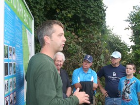 Randall Van Wagner, greening partnership coordinator with the Lower Thames Valley Conservation Authority, speaks to people at the Rotary Eco Trail entrance before leading them on a tour.