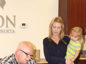 Mayor Bruce Marriott signs a proclamation on behalf of the Town of Vermilion, recognizing Oct. 2 as World Cerebral Palsy Day.