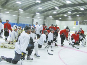 The would-be Whitecourt Wilds gather to hear instructions from their head coach, Allan Measures, a former professional who played in Finland for 14 years after playing for in the Vancouver Canucks farm system.
Ann Harvey | QMI Agency
