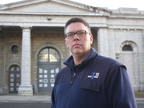 Jason Godin stands outside the former Kingston Penitentiary. Whig-Standard file photo.