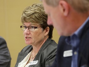 Quinte Health Care president and CEO Mary Clare Egberts briefs the board Tuesday during a meeting at Belleville General Hospital. At right is chief of staff Dr. Dick Zoutman.