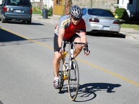 Const. Steve Cudney of the St. Thomas Police Service rides near the police station on Tuesday. Cudney is one of over 100 riders who plan to cycle from Aylmer to Ottawa this week to raise money for the families of fallen officers. The ride is also meant to raise awareness of the sacrifices officers have made.