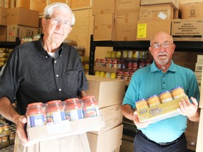 Bob McDowell and Herb McGowen of the Seaforth and District Food Bank help unload some much-needed items.