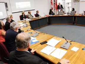 Michael Laurie, education officer at the Ministry of Education's Ottawa regional office, (top right) recognizes Mandy Savery-Whiteway as Hastings and Prince Edward District School Board's new director of education during the board's last meeting in Belleville, Ont. Monday evening, Sept. 23, 2013.  JEROME LESSARD The Intelligencer