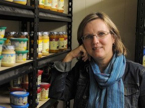 Ruth Ingersoll, executive director for Community Development Council of Quinte, stands with food used for the Good Baby Box program. Recent information from Statistics Canada shows one in three children under the age of six in Belleville live in poverty.