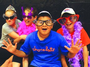 Wacky costumes helped create a fun and carefree atmosphere for the photobooth at the Pope Jean Paul II School’s carnival open house on Tuesday, Sept. 24.