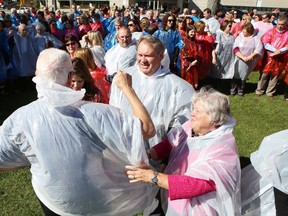 Kingston General Hospital staff, volunteers and guests don coloured ponchos as part of a commemorative photograph as part of celebrations Wednesday to mark the hospital's 175th anniversary.
Elliot Ferguson The Whig-Standard
