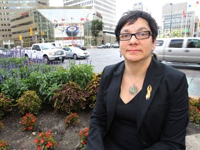 Coun. Jenny Gerbasi at the northeast corner of the intersection of Portage Avenue and Main Street. Gerbasi has asked to begin discussions on opening the intersection to pedestrians in 2017 when a 30-year deal to keep it closed ends. (KEVIN KING/Winnipeg Sun)