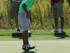 Swade Hall, a grade 11 student at St. Patrick's, taps in for birdie on the 18th hole of the LSSAA Golf Championships Wednesday. Swade fired a three-under 68 to win the tournament by seven strokes. SHAUN BISSON/THE OBSERVER/QMI AGENCY
