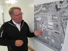 Ian Smith, Sarnia's director of parks and recreation, looks at a photograph of Clearwater Park where a dog park is being proposed. The department held a public meeting Wednesday to gather comments about the plan before it goes to city council for consideration. PAUL MORDEN/ THE OBSERVER/ QMI AGENCY