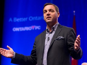 Ontario Progressive Conservative leader Tim Hudak talks to the party faithful during a town hall meeting Sept. 22, 2013 at their convention at the London Convention Centre in London, Ont. (MIKE HENSEN/QMI AGENCY)