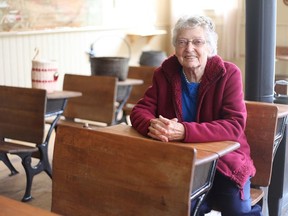 Vera Dafoe sits in the same spot she sat as a young girl attending the one-room Tyner School on Lime Lake Road, near Roblin. She attended Grades 1 through 8 at the school in the 1940s and 1950s.