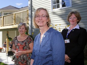 The Heart of Hastings Hospice's chairwoman, Dr. Janet Webb, is flanked by staff Doris Bush, left, and new director Donna Frair outside the hospice house in Madoc Friday. Staff and volunteers celebrated the Ontario Trillium Foundation's granting of $87,500 for a wheelchair ramp and the hiring of Frair. - LUKE HENDRY The Intelligencer