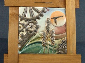 This is Parkland County’s new commemorative art piece: Synchronicity. Commissioned from Tarra Wedman, the piece is made of tile and shows a simple, elegant design tying together industry, agriculture and ecology to describe the county. - Photo Supplied
