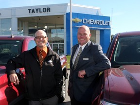Jason and Derek Taylor on the car lot of the Taylor AutoMall. The dealership celebrates its 50th anniversary on Saturday.
Ian MacAlpine The Whig-Standard