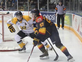 Sarnia's Anthony DeAngelo defends against the Erie Otters' Connor McDavid during the second period of their game on Friday, Sept. 27. McDavid had a goal and two assists in Erie's 6-3 win. SHAUN BISSON/THE OBSERVER/QMI AGENCY