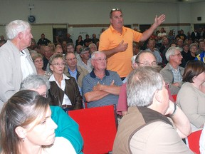 West Elgin resident Michael Parezanovic makes a point at a public meeting at the Elgin‌ International Centre on wind turbines Tuesday. More than 250 people attended -- most, apparently in opposition to turbines.