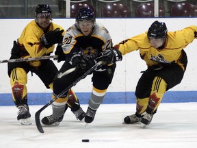 Tillsonburg Thunder Terry Lammens (left) and Justin Salt (right) attempt to corral Tavistock's Andrew Schaaht Saturday evening during exhibition action at the Kinsmen/Memorial Arena. The regular season opens this coming Saturday (October 5) with Milverton in town for a 7:30 p.m. opening faceoff. Jeff Tribe/Tillsonburg