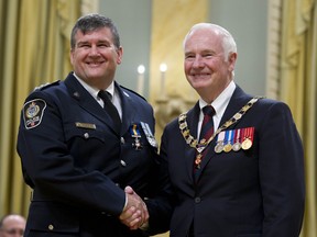 David Johnston, Governor General of Canada, presided over an Order of Merit of the Police Forces investiture ceremony, where he awarded Scott Thompson in Ottawa, May 9, 2012. (QMI Agency file)