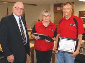 Mayor Howard Dirks presented Sept. 23 Vulcan Centennial Committee co-chairs Louise Schmidt and Dave Munro with a certificate of appreciation for their role in making the Town's 100th birthday celebration a reality. Schmidt asked the council why the centennial flags had already been taken down.
