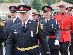 Sarnia Police Services Chief Phil Nelson leads officers from Sarnia police, RCMP, OPP and the Canada Border Services Agency into Redeemer Lutheran Church Sunday. The Sarnia church was the site of the 24th Annual Police and Peace Officers' Memorial Service, remembering fallen Canadian police and peace officers. TYLER KULA/ THE OBSERVER/ QMI AGENCY