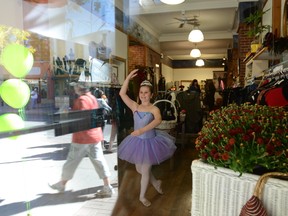 Rhianna Mathers strikes a ballet pose in the window of Hello Gorgeous Boutique on Front Street Saturday during Culture Days.