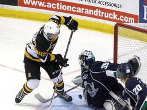 Kingston Frontenacs' Spencer Watson gets stopped by Plymouth Whalers goalie Alex Nedeljkovic in Ontario Hockey League action at the Rogers K-Rock Centre in Kingston on Sunday. Ian MacAlpine/QMI Agency