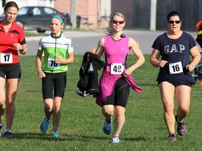 From left, Vera Nagelhout, her daughter Linda, Anne Battell and Tiffany Landon head toward the finish line of their first 3K leg Sunday morning during the Tillsonburg Charity Duathlon. The multi-sport race is organized by Tillsonburg triathlete George Papadakos as a multi-purpose event to raise the profile of multi-sport competition in the area, provide a race, and finally, to raise money for the Alzheimer's Society of Oxford. Jeff Tribe/Tillsonburg News