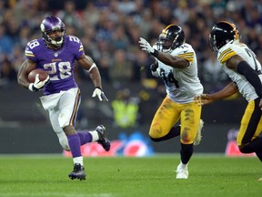 Vikings running back Adrian Peterson had a big day against the Pittsburgh Steelers in London on Sunday. (REUTERS)