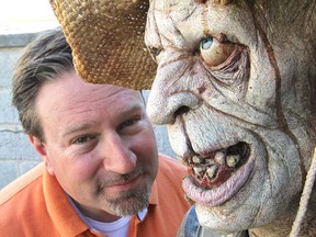 Fort Henry’s Neil Shorthouse, with one of the zombies waiting to scare people at this year’s Fort Fright, says the 2013 version has expanded into the ditch around the fort with a whole new set of horrors. (Michael Lea The Whig-Standard)