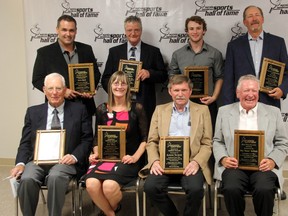 The Sarnia Lambton Sports Hall of Fame held its induction dinner on Saturday, Sept. 28, where they seven individuals individuals and one team for contributions and excellence in Sarnia Lambton sports. Pictured in the front row are inductees Bill Riley, Sue Weir, Arsene Tanguy, and Don McPhail. In the back row are inductees Kris Hall, Doug White, honouree Tyler McGregor, and inductee Gord Neely Sr. SHAUN BISSON/THE OBSERVER/QMI AGENCY