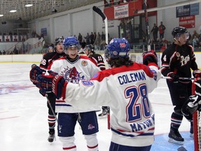 Strathroy Rockets forwards Dan Chapman and Tyler Coleman celebrate a third period goal against the Lambton Shores Predators at the West Middlesex Memorial Centre Sunday. After dropping the home opener vs. Leamington a night earlier, Strathroy bounced back with a 5-2 win, improving their record to 5-2.
JACOB ROBINSON/AGE DISPATCH/QMI AGENCY