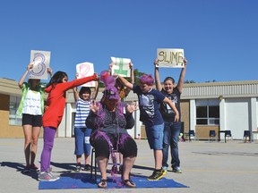 LCPS principal Mary Martha Uttley-Shaw was the lucky recipient of some purple slime as Grade 4/5 students Tika Kahgee (left) and Tyler Hallam (right) poured it on. Mr. Browne's Grade 4/5 got the privilege to do the sliming because their class helped raise the most money for the Terry Fox Run.