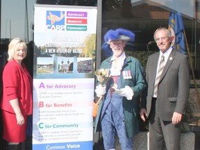 National Seniors Day Oct. 1 was marked with a flag raising at the Chatham-Kent Civic Centre. From left are CARP Chapter 49 chair Susan Bechard, Town Crier George Sims and Mayor Randy Hope.