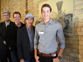 Corey Dubeau and Larry Lau of ATMOS Marketing with Shawn Adamsson and David Billson of rtraction at the Great Western Railway Roundhouse Oct.1, 203 in London, Ont. ATMOS and rtraction will be moving into the historic building. SHOBHITA SHARMA/LONDONER/QMI AGENCY