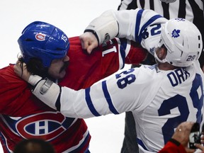 Montreal's George Parros and the Leafs' Colton Orr slug it out.(Martin Chevalier/QMI Agency)